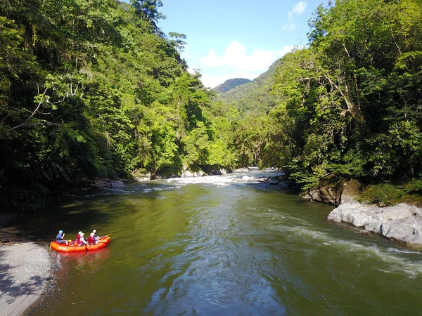 A red raft in the distance in the Rio Verde, Antioquia