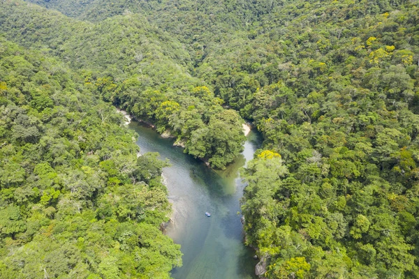 Dron shot of a raft in the confluence between the Rio Verde & the Rio Calderas forming the Samaná River Colombia