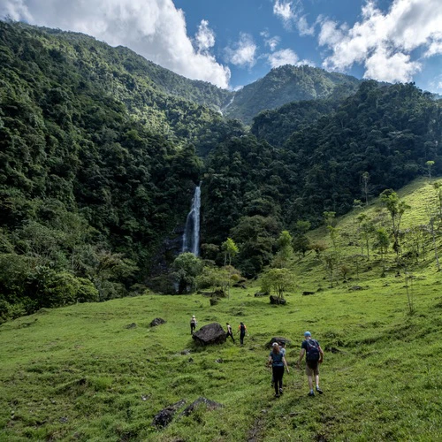 Group of hikers in front of a mountain in the valle de las cascadas, antioquia, colombia