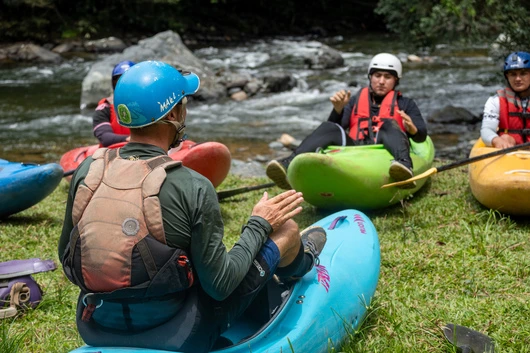 Kayak intro course group listening to expert instructor instructions